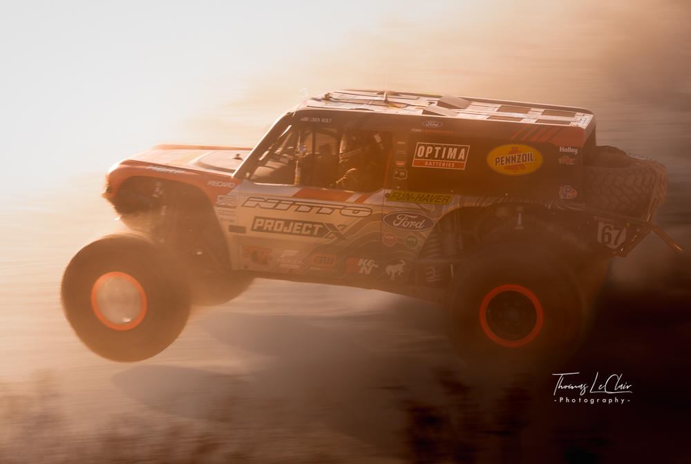 Off-road racing scene, automotive action photograph